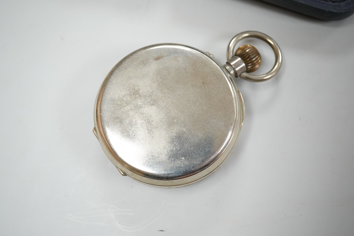 An Edwardian hammered silver mounted travelling pocket watch case, Wilson & Gill, Birmingham, 1903, containing a nickel cased pocket watch.